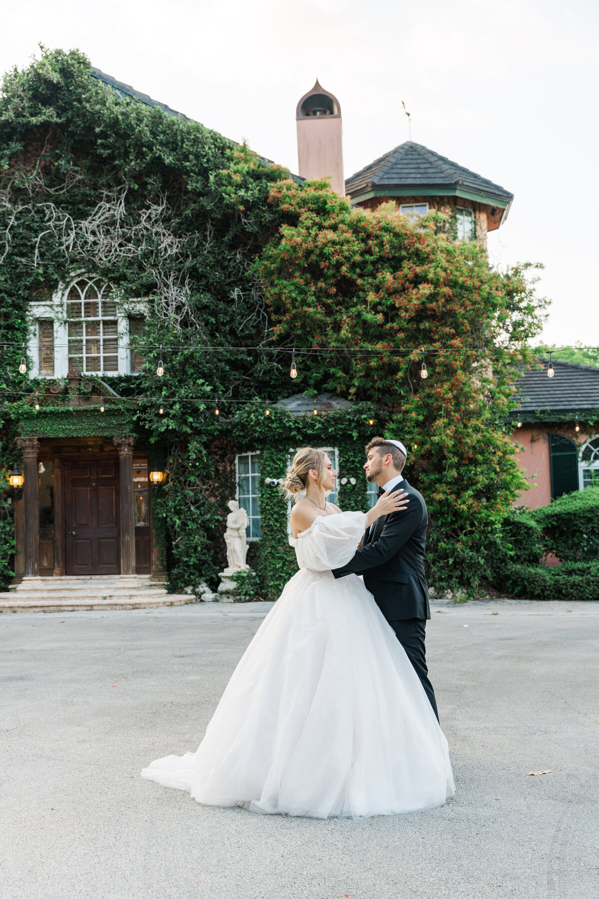 bride and groom facing each other