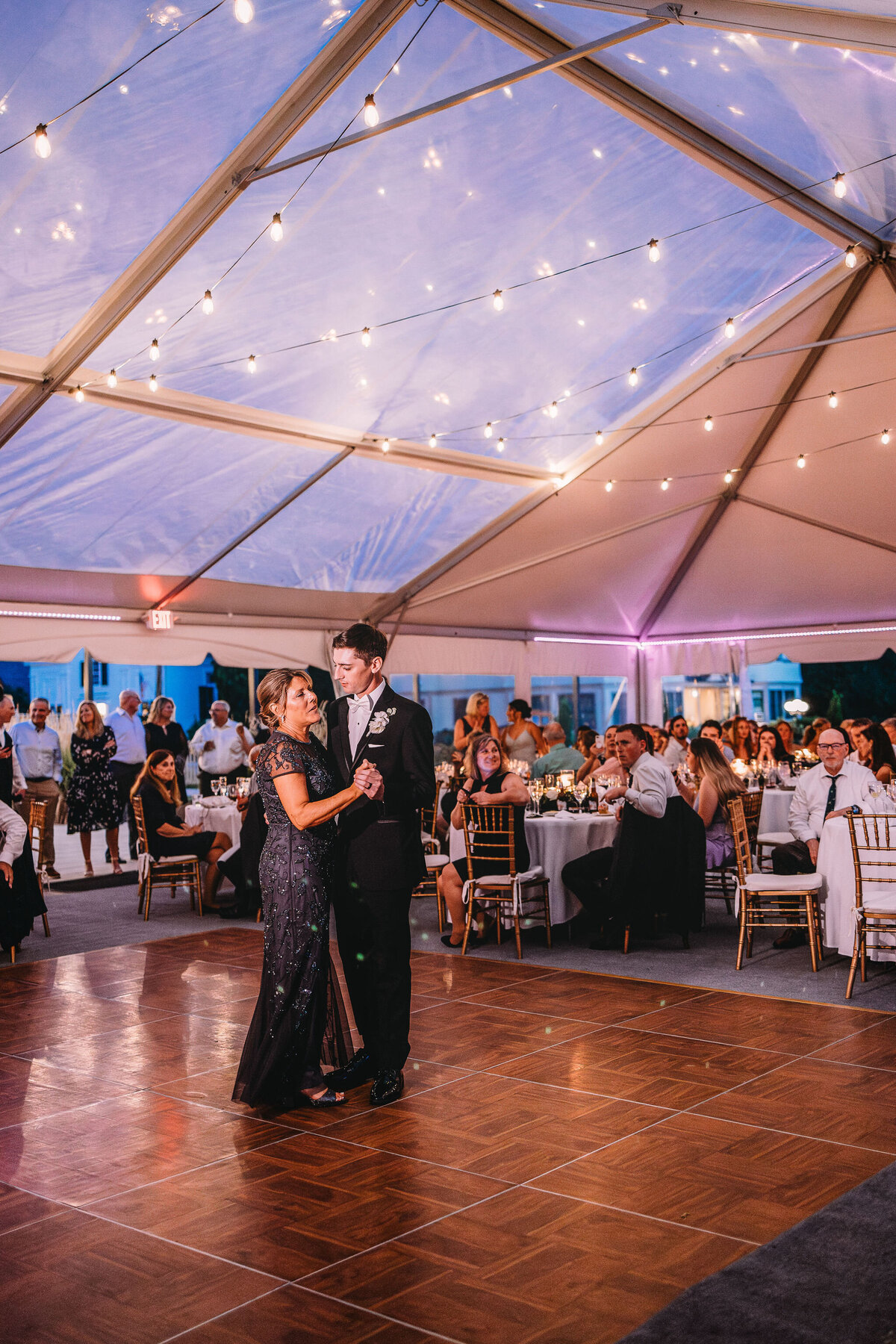 Mother  and son dance in tented wedding reception at The Wentworth Inn in Jackson NH by Lisa Smith Photography