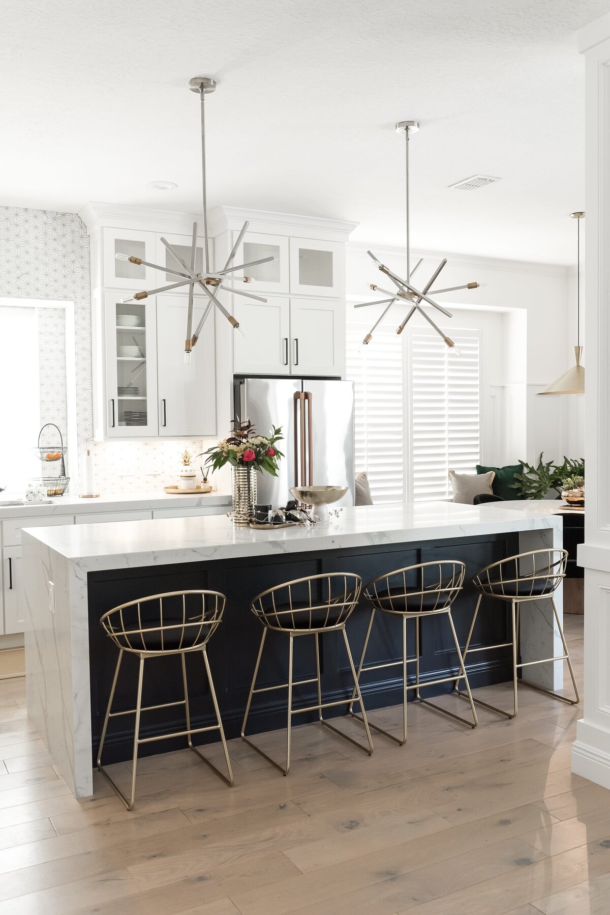 dewine design orlando interior designer modern lakehouse kitchen with marble island and accent pendents