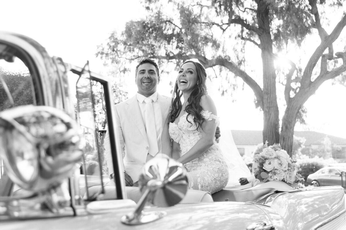 Candid black and white of bride and groom