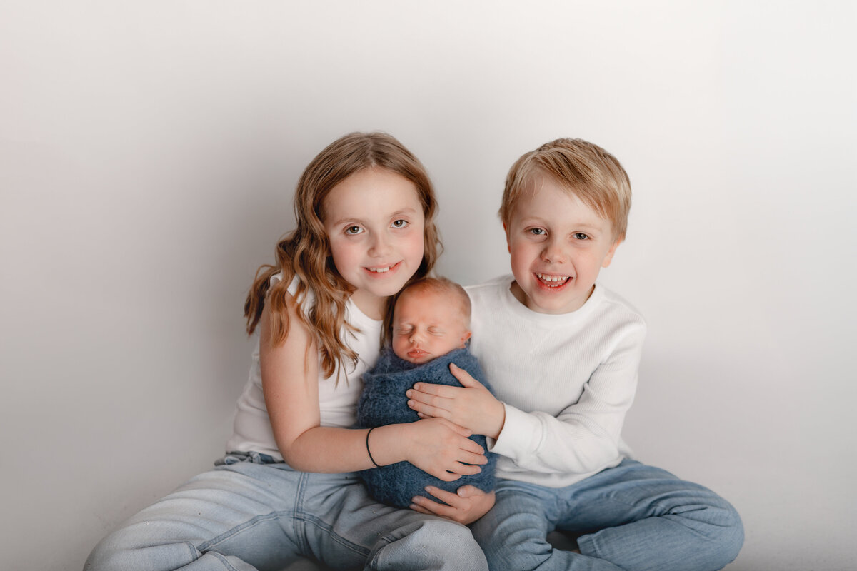 Siblings-white background-sitting-Hicksville studio
