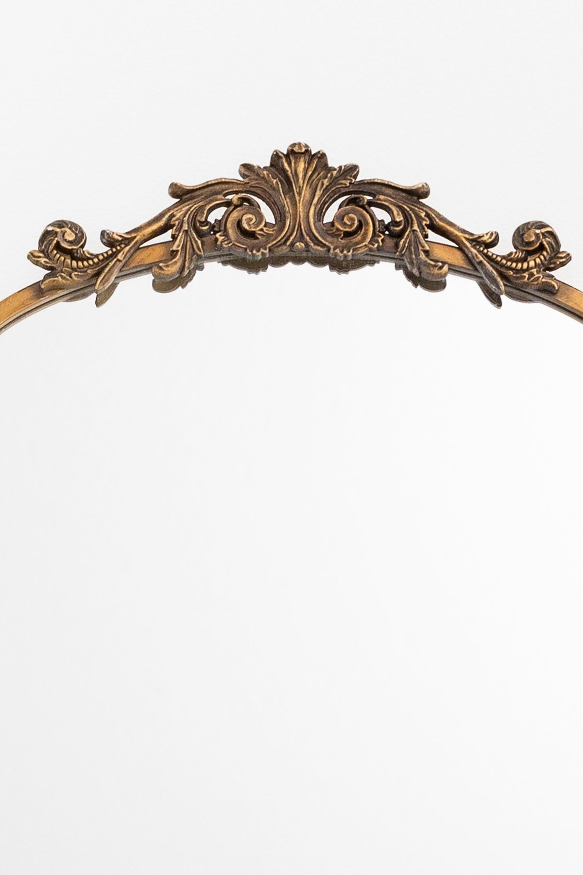 Medium arch mirror with ornate ornament on top