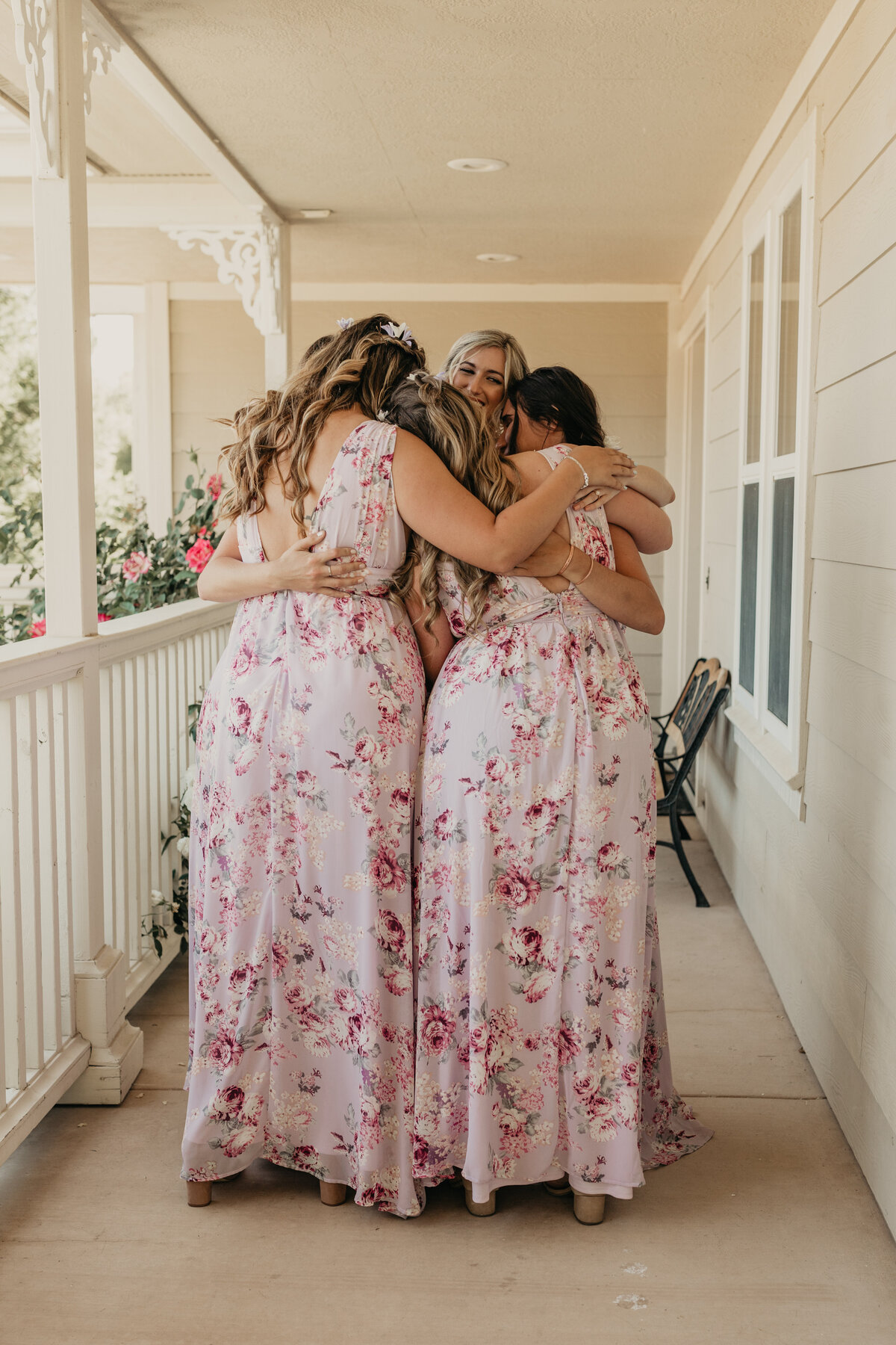 Maralyn-Estate-Garden-Atascadero-CA-wedding-bride-bridesmaids-hugging-after-first-look