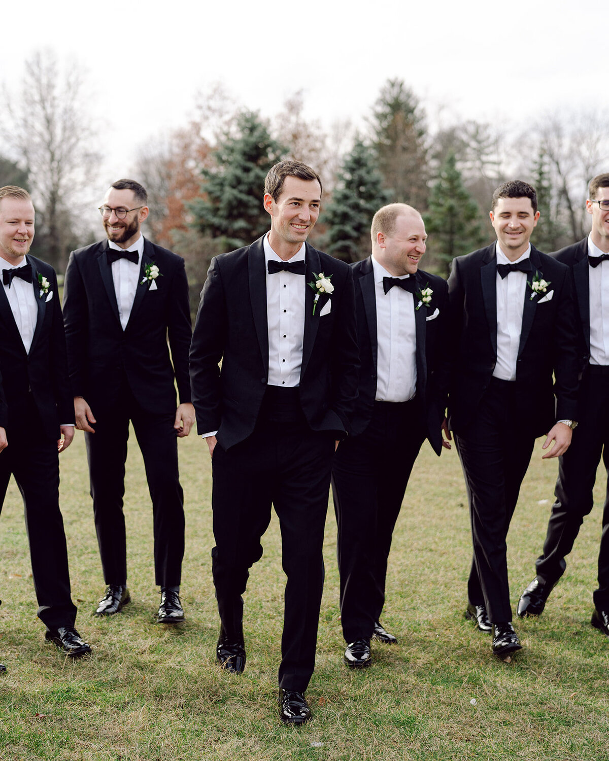 Groomsmen walking at a Columbus venue shot by Philadelphia photographer.