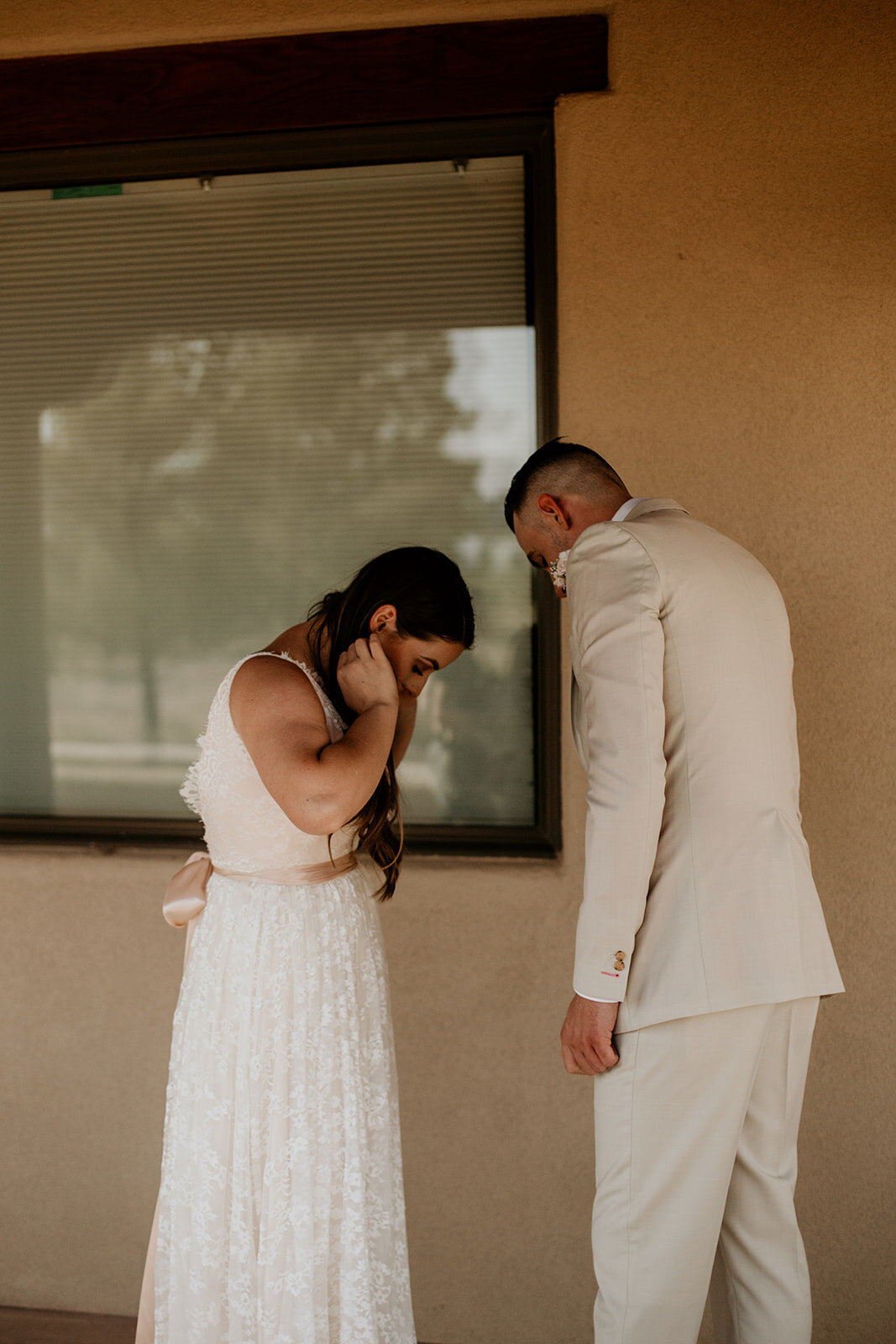 bride and groom seeing each other for the first time before the ceremony