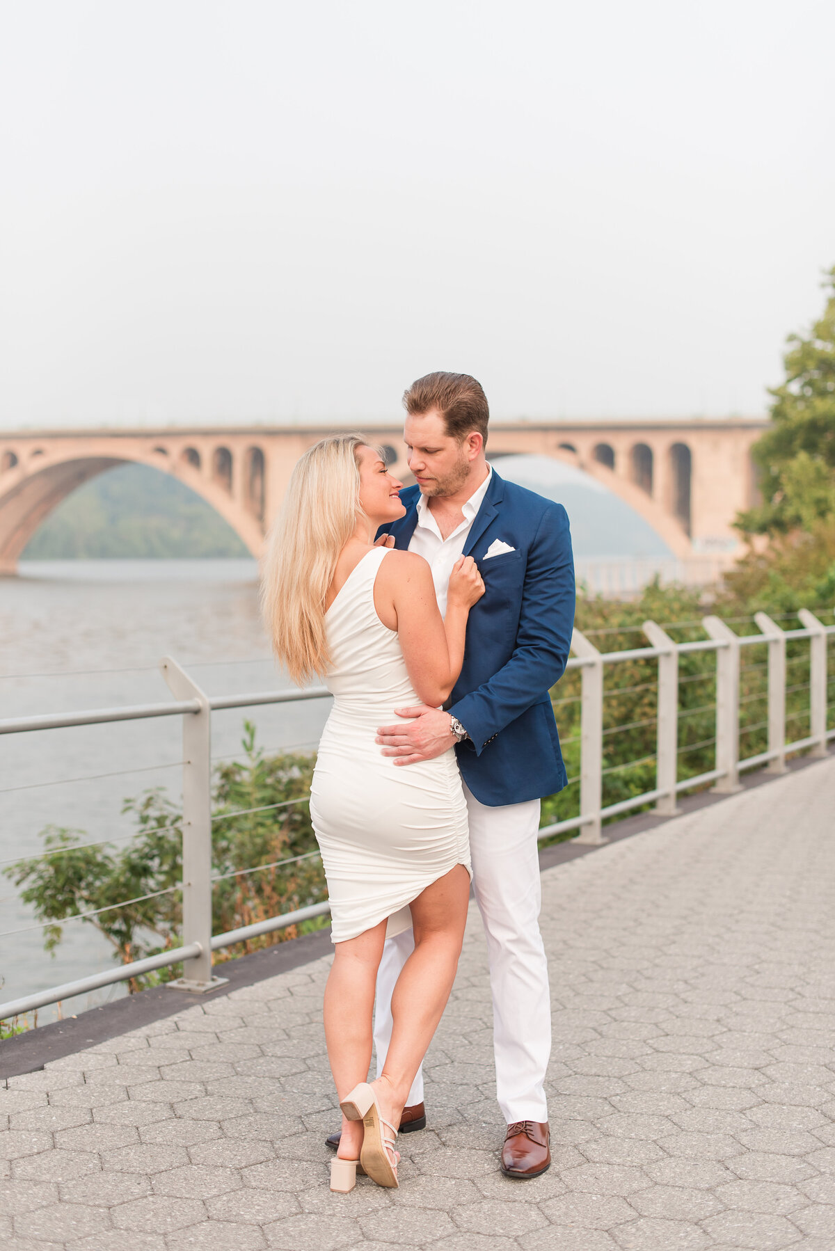 model pose of couple in goergetown blue sports coat and white dress