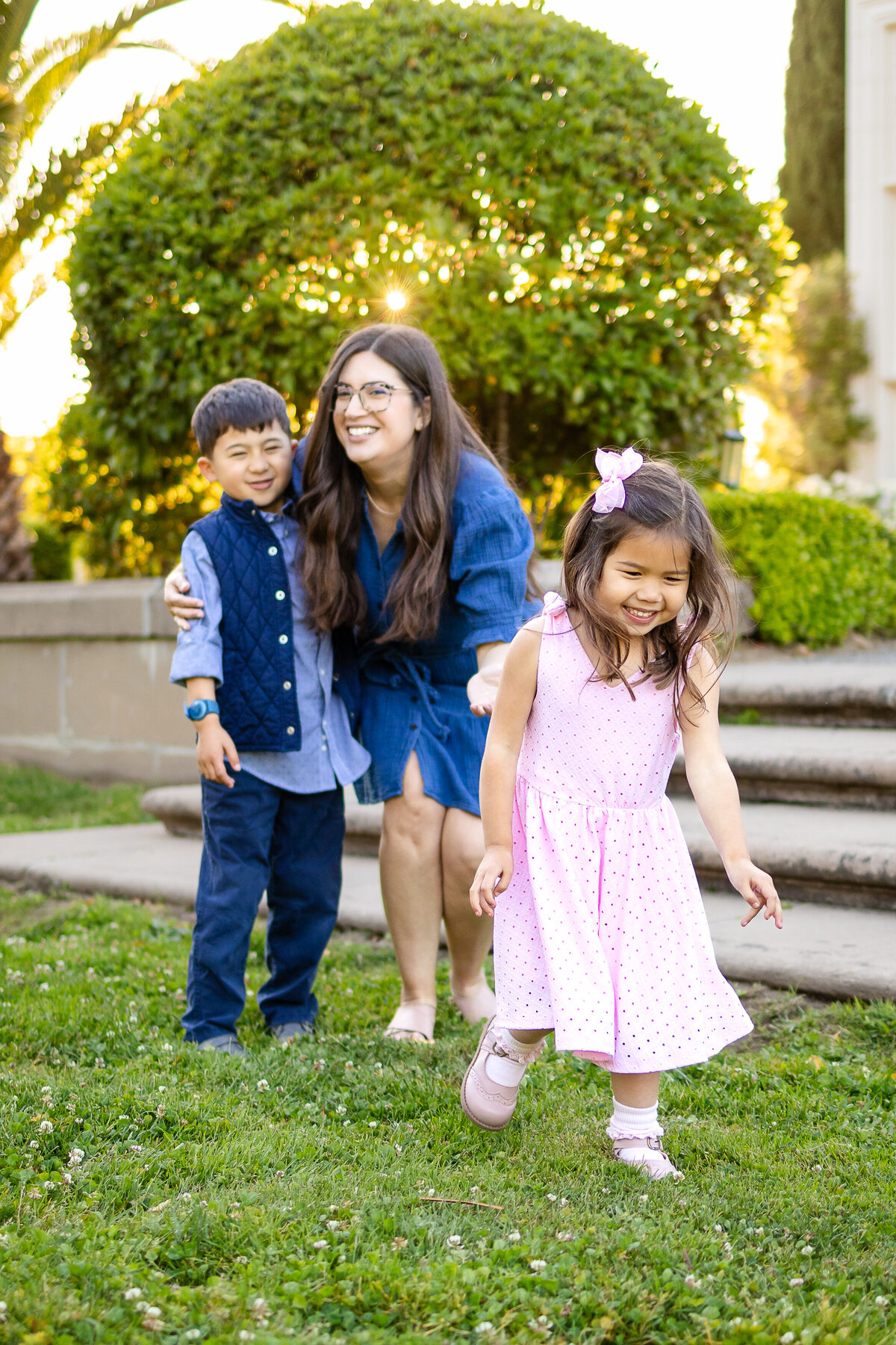 Joyful mother and two kids hugging during a golden hour session – Ellobelle Photography, San Francisco Peninsula family photographer kohl mansion Burlingame