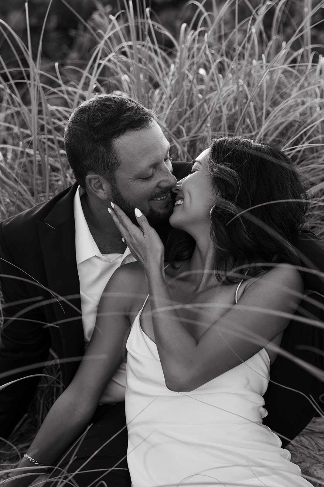 couples photos in field during nyc engagement