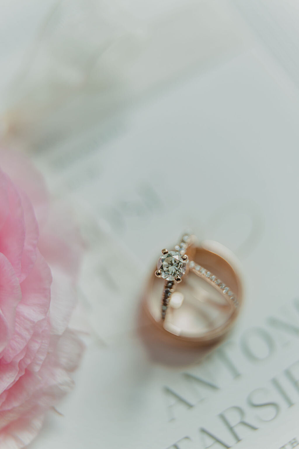 Close-up of the wedding rings, symbolizing eternal love, elegantly presented against a backdrop that reflects the couple's unique style.
