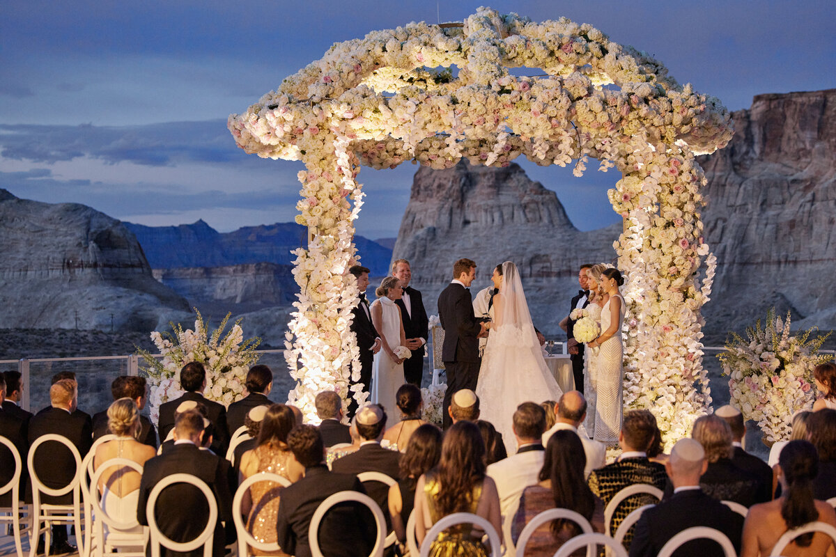 Ceremony at dusk under chuppah at Amangiri Utah