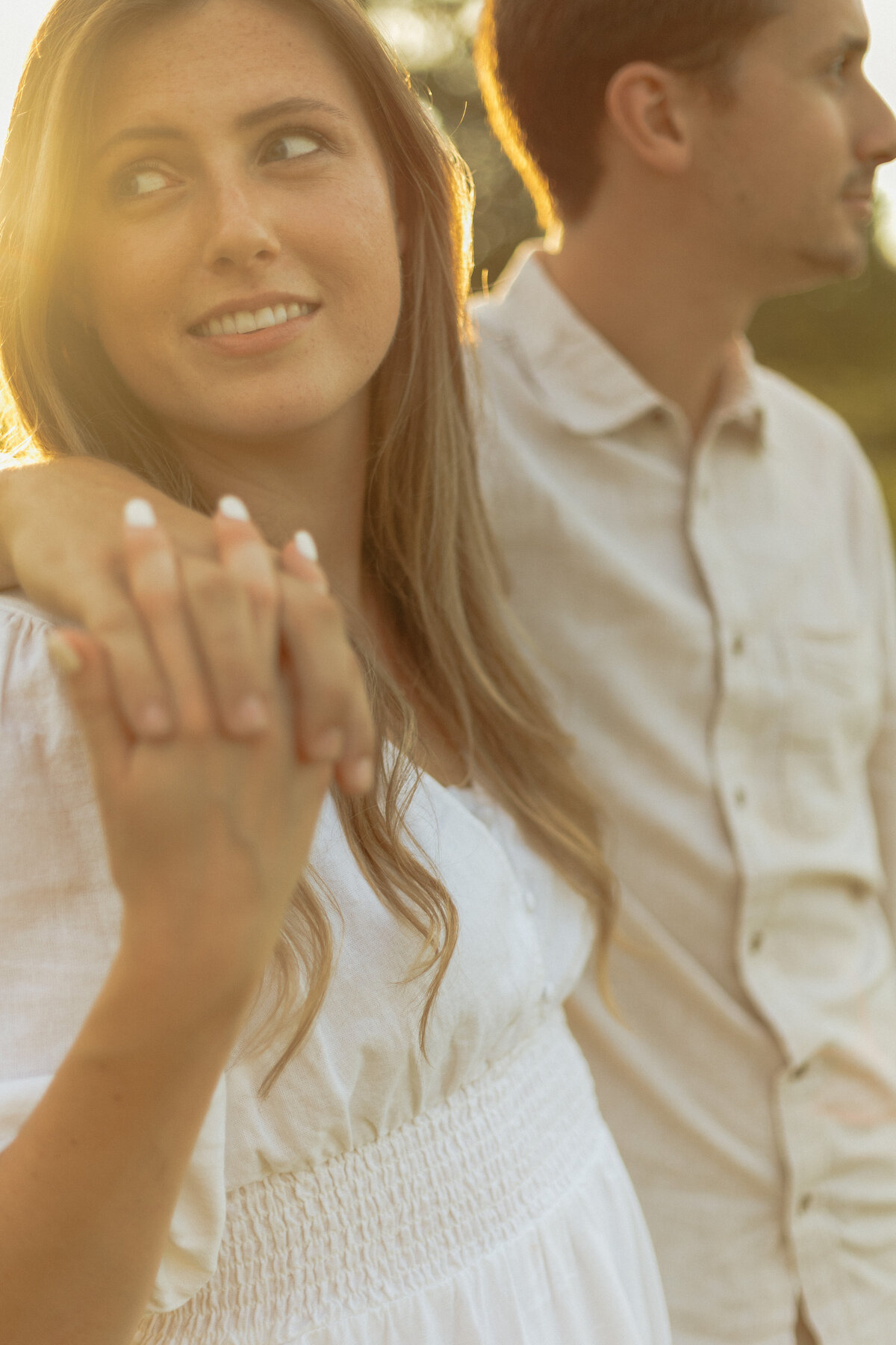Intimate winery picnic session with lush palm trees and bright natural light

