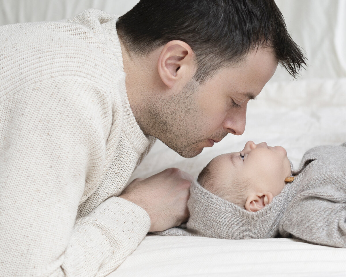 Portrait of a baby and his father.