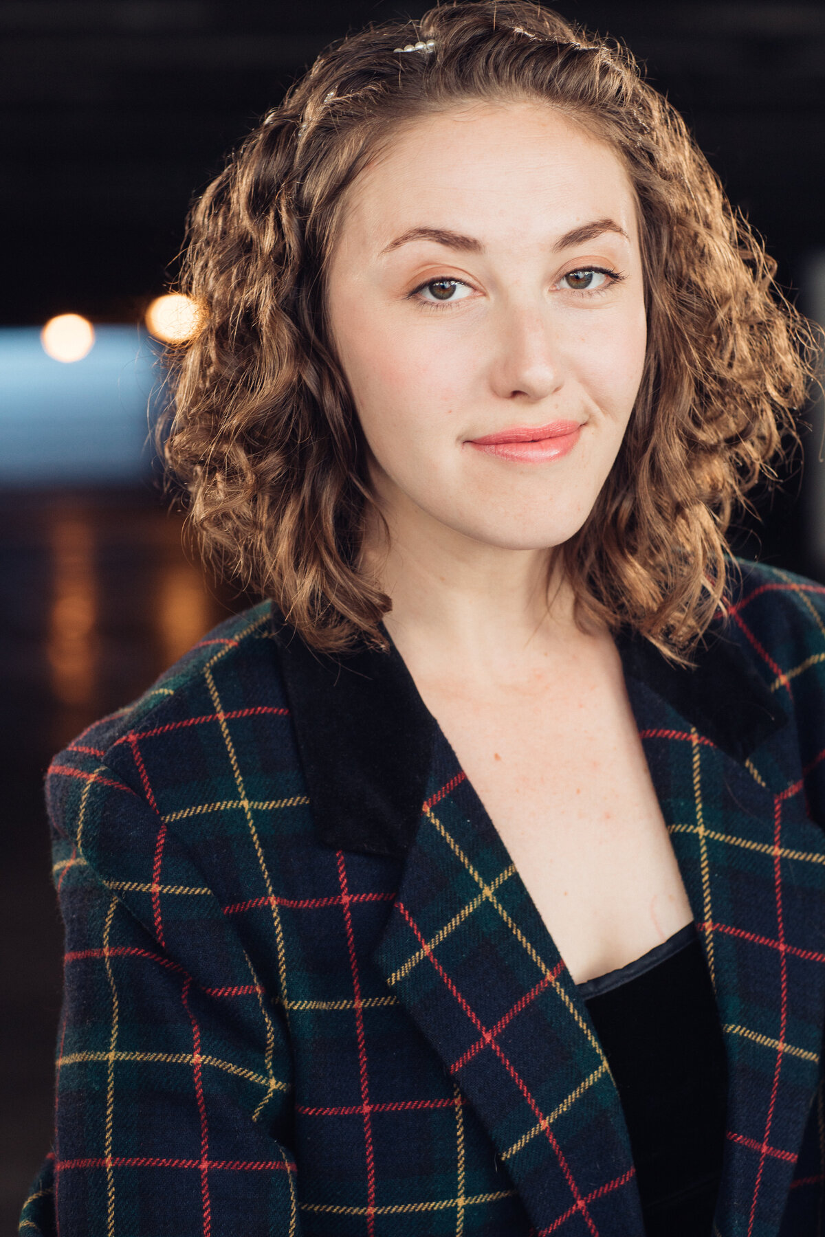 Headshot Photograph Of Young Woman In Outer Black Checkered Blazer And Inner Black Blouse Los Angeles