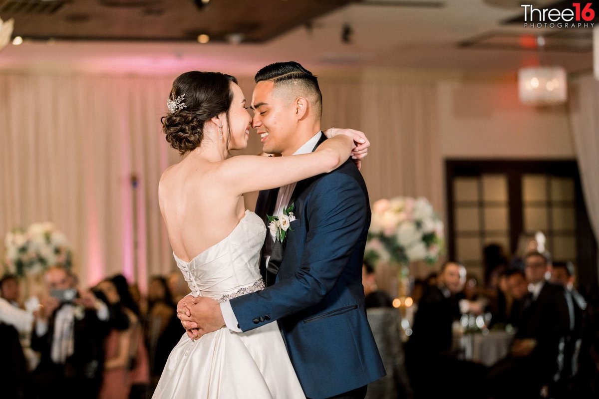 Tender moment between Bride and Groom during their first dance