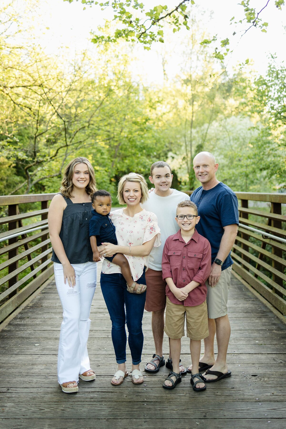 Family takes a picture together in a wooded park in Tennessee
