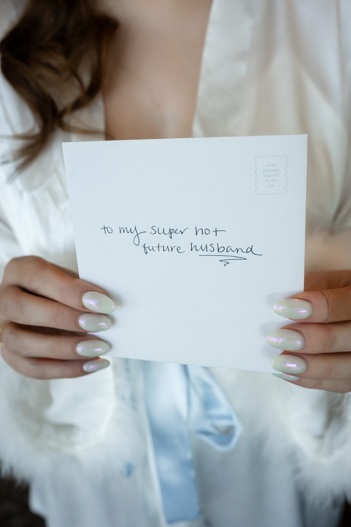 bride holding a note to her future husband