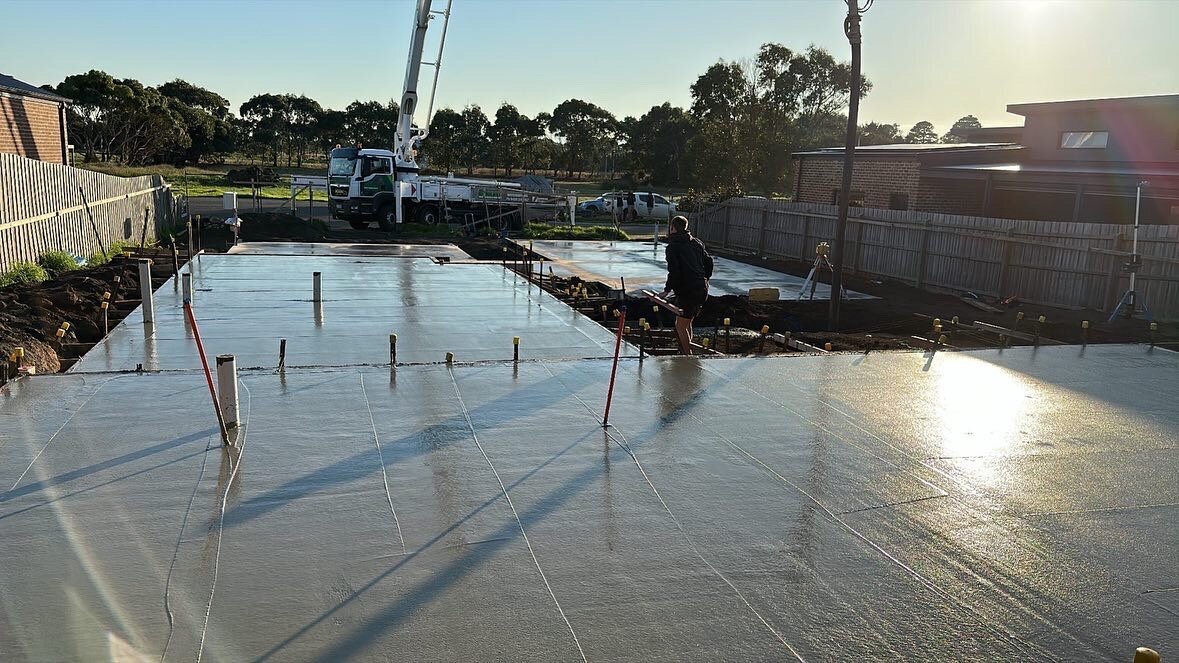Professional Concreting Team at work on residential slab pour.