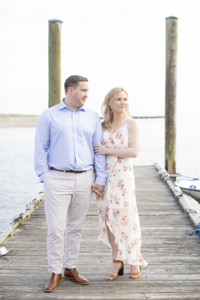 wooden dock portraits for engaged couple in Southport