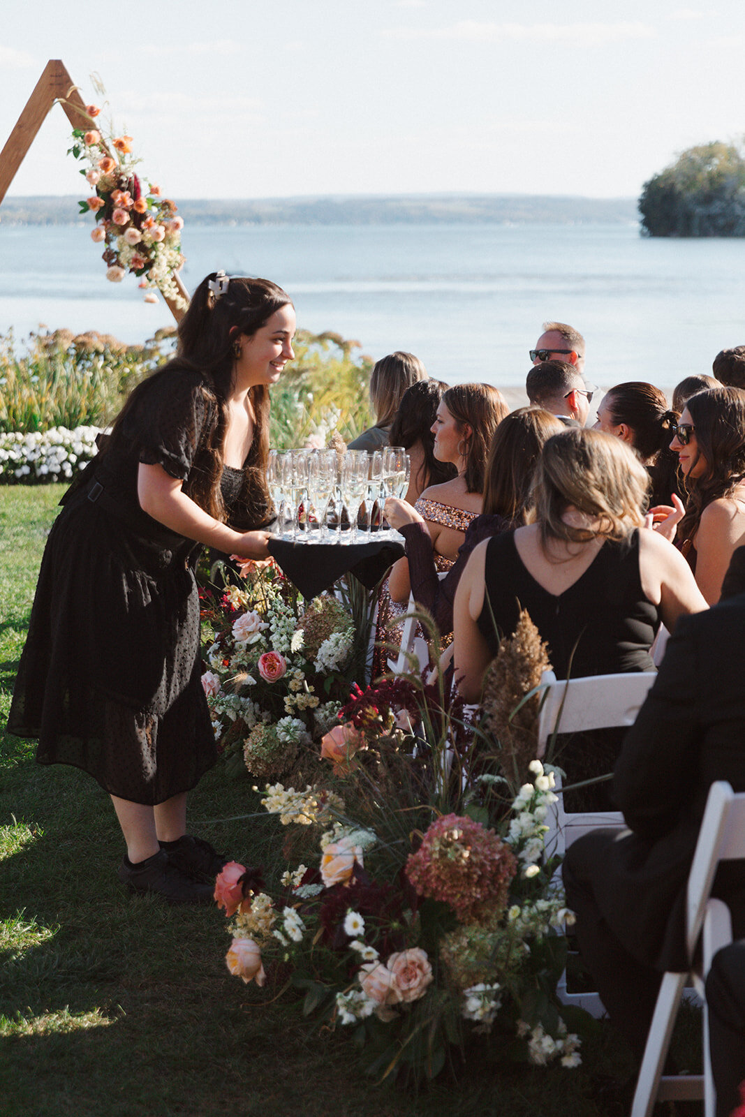 The Lake House on Canandaigua passing out champagne for guests before the wedding ceremony starts