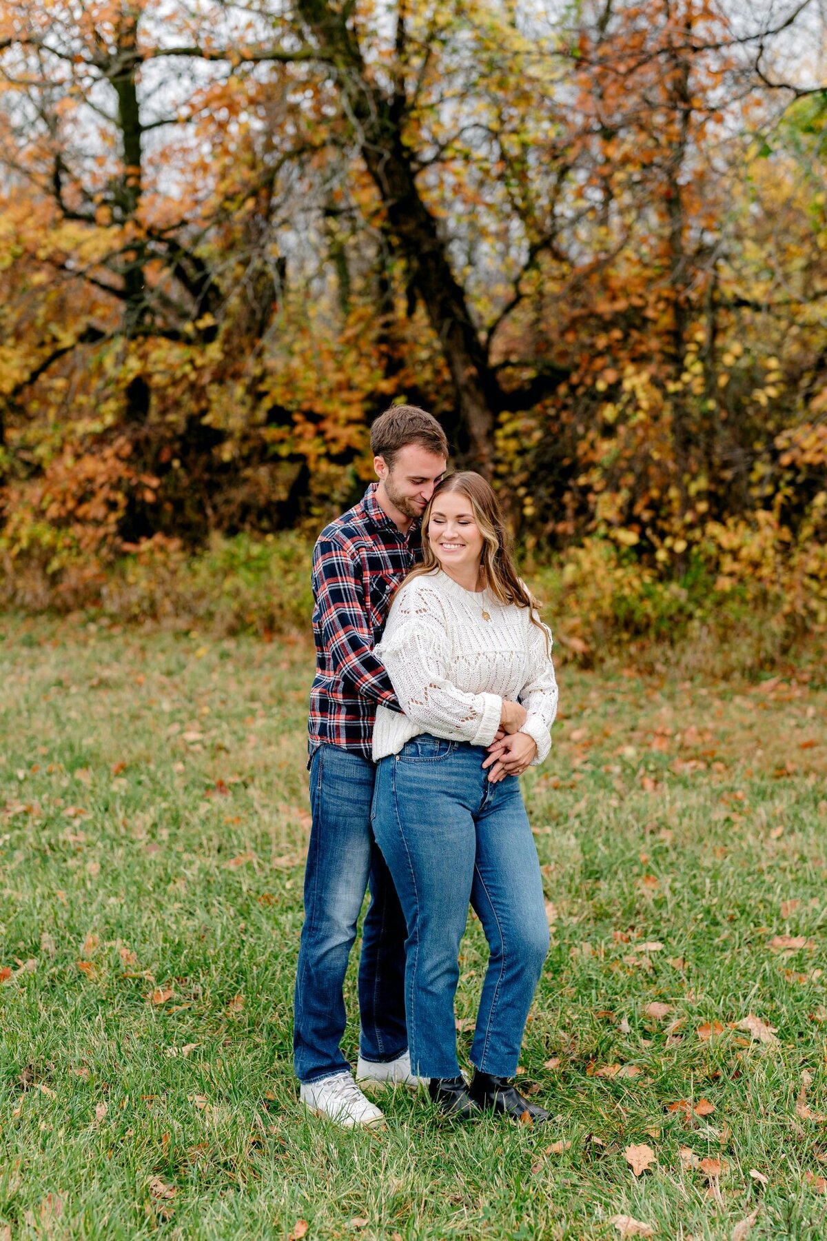 groom-wrapping-arms-around-bride-to-be-engagement