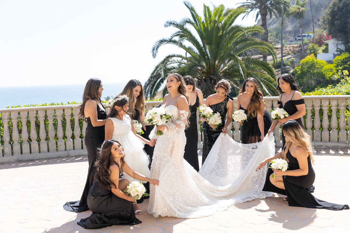 Brides maids helping the bride