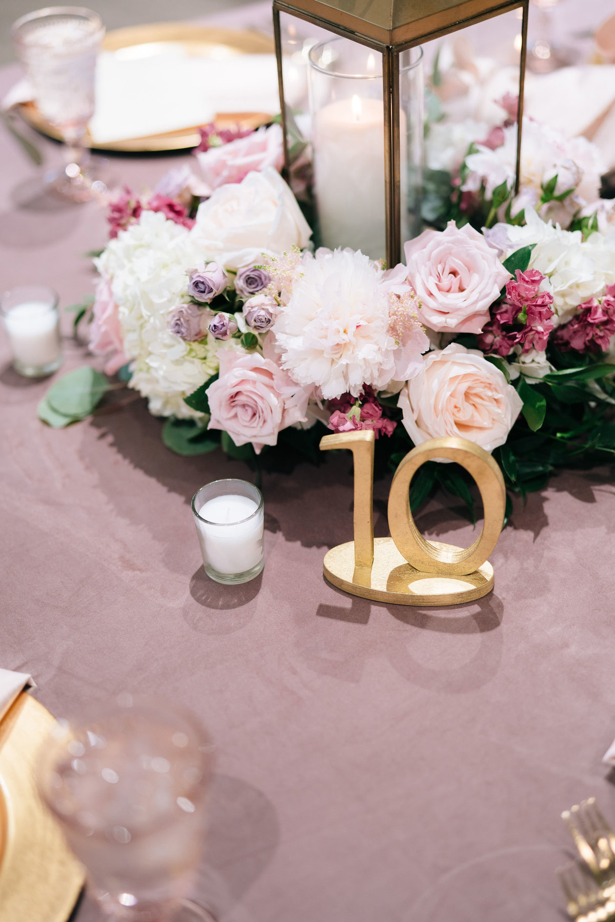 Blush tablescape with gold table numbers
