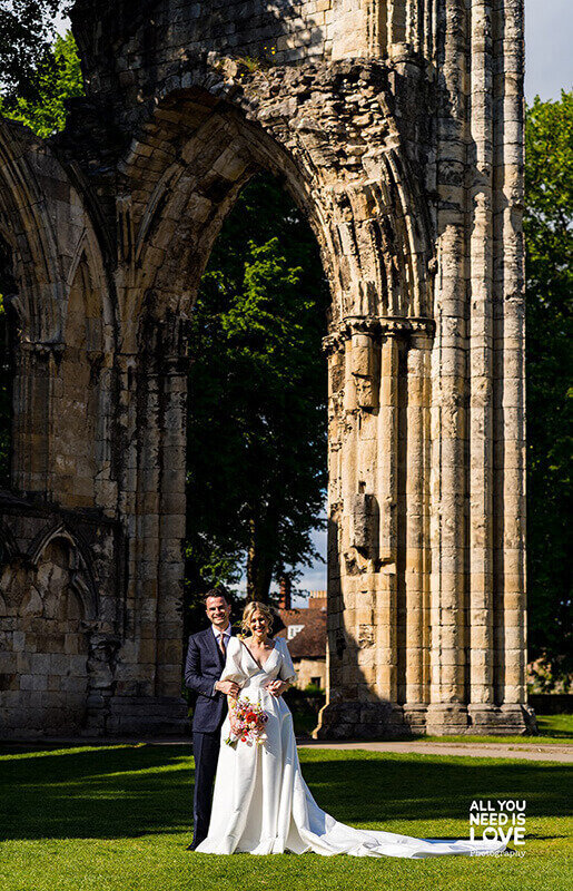 Married couple in venue garden 437