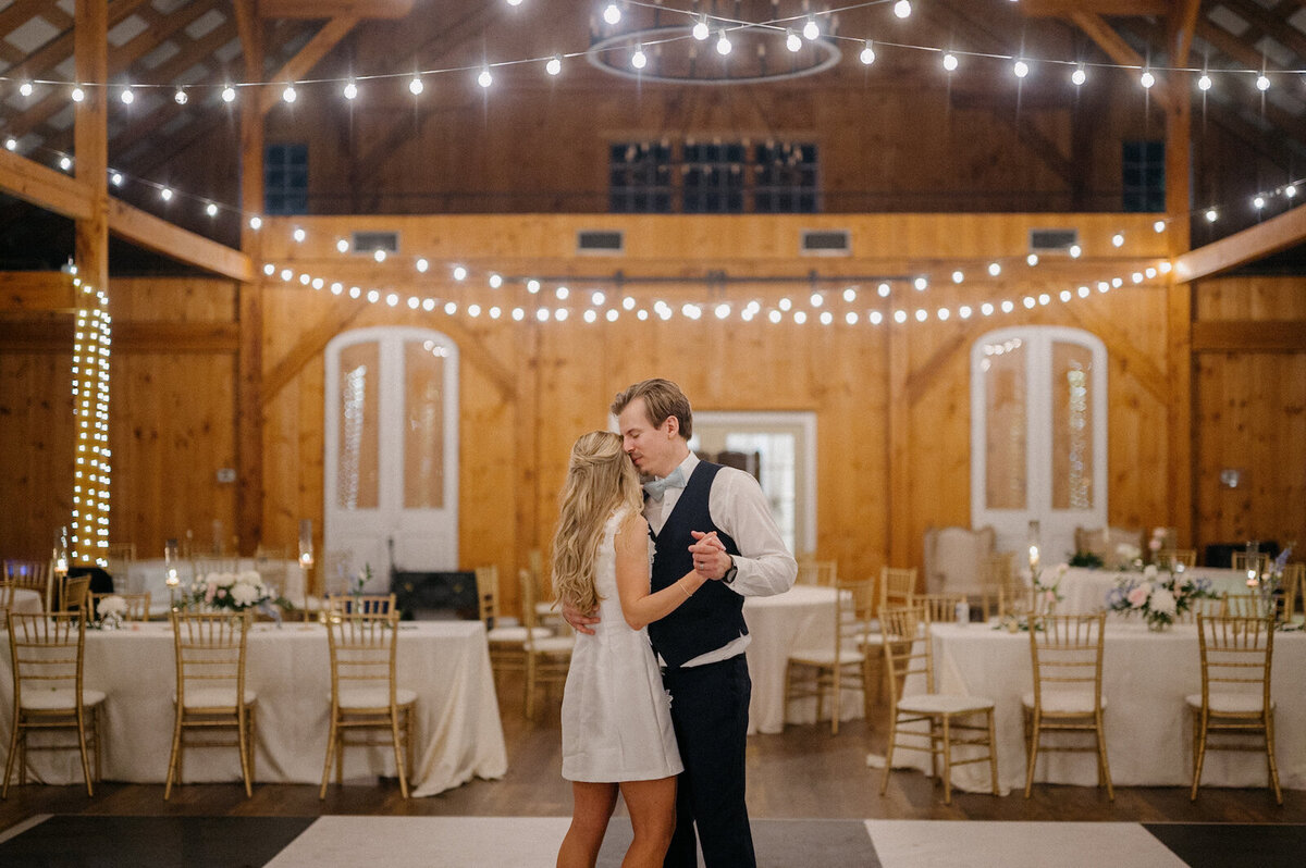 Bride and groom dancing in the center of the dance floor