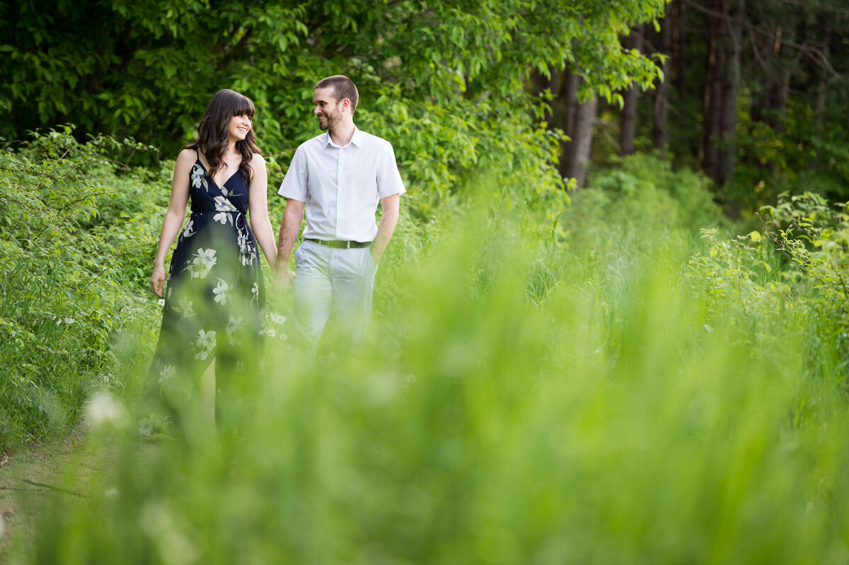 a couple walks hand in hand taken during their family photos  in Ottawa