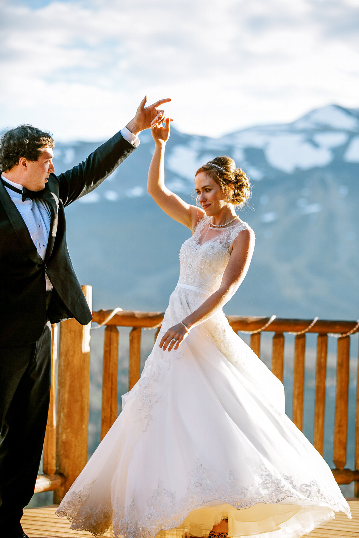 A wedding couple dance on the deck of Colorado's Lodge at Breckenridge