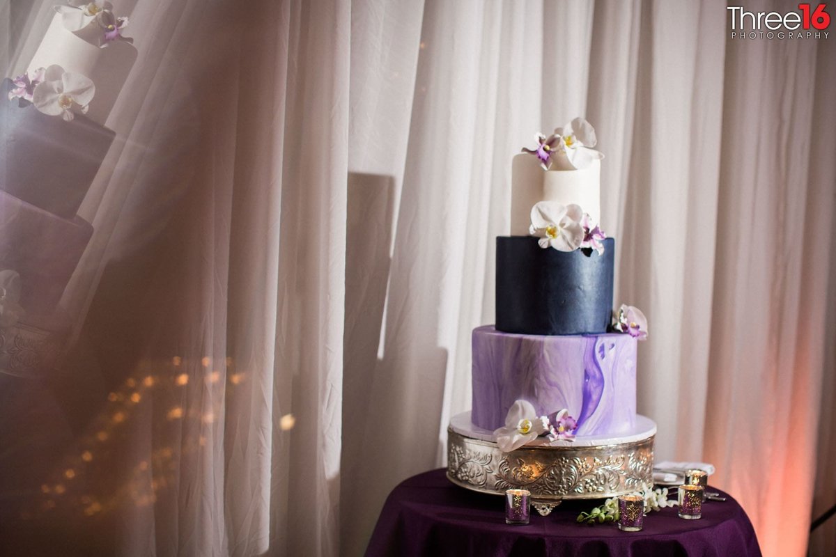Multi-colored three-tiered wedding cake