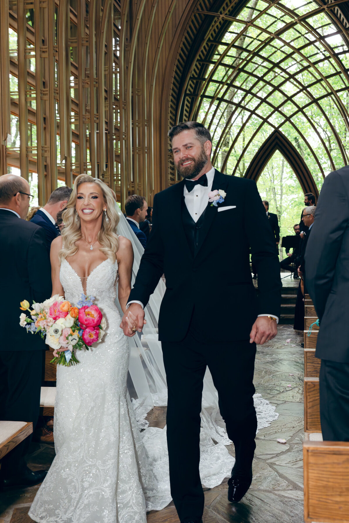 A wedding photo of the bride and groom on the alter at Anthony's Chapel in Hot Springs Arkansas