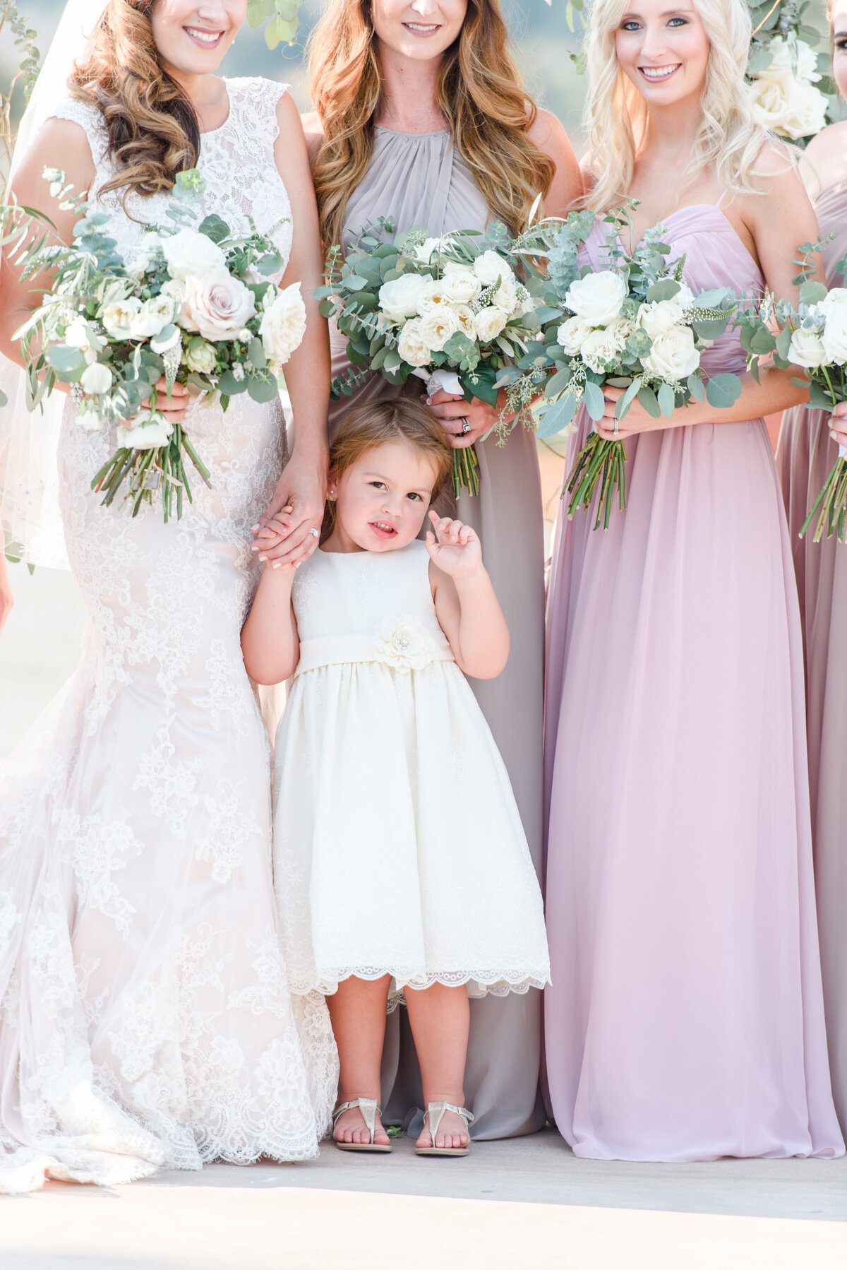bridal party holding flower bouquet