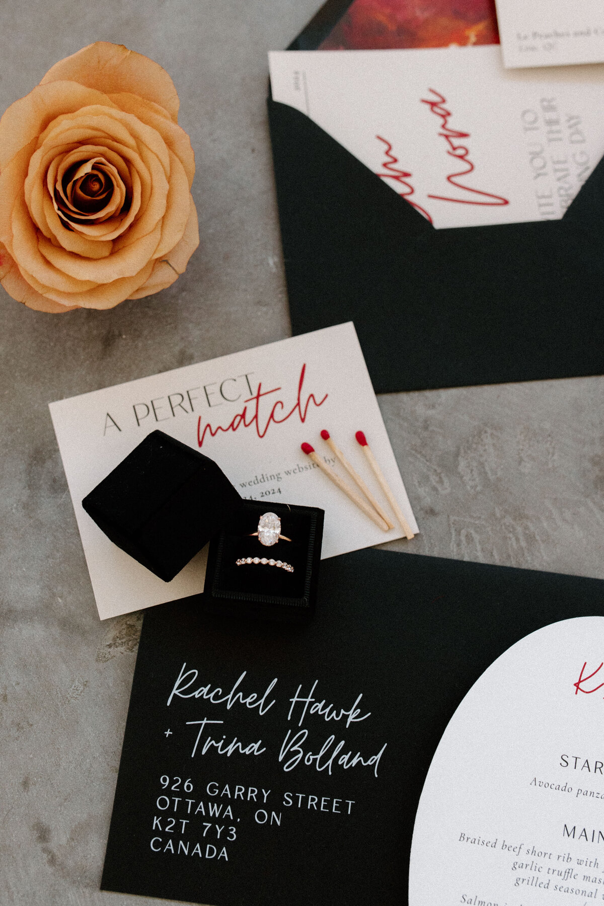 Detail shots of the wedding invitation and the wedding rings for a wedding photography session