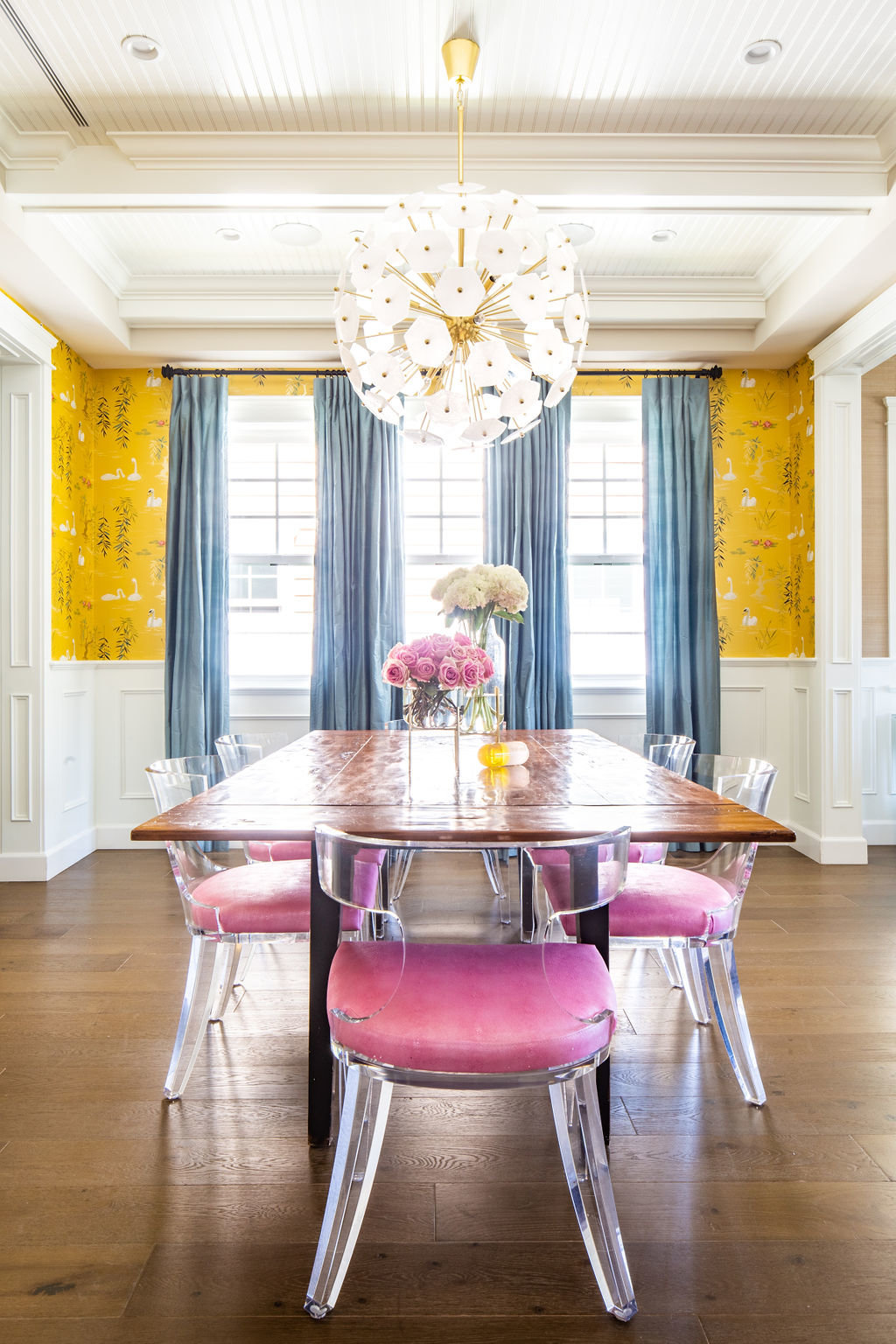 Dining Room Nina Campbell Swan Lake, wainscoting, and Lucite chairs with pink cushions