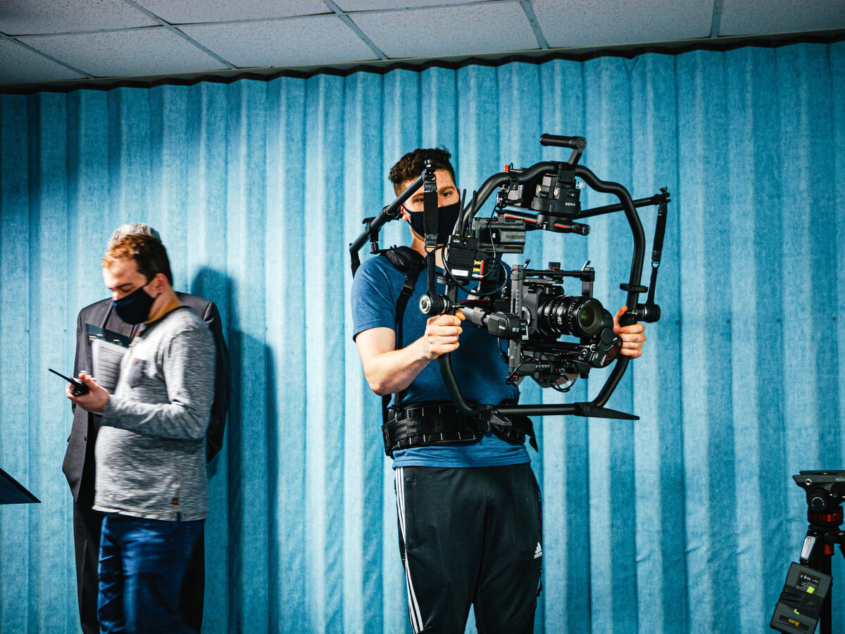 Jacob Metzger holding a  cinema camera.