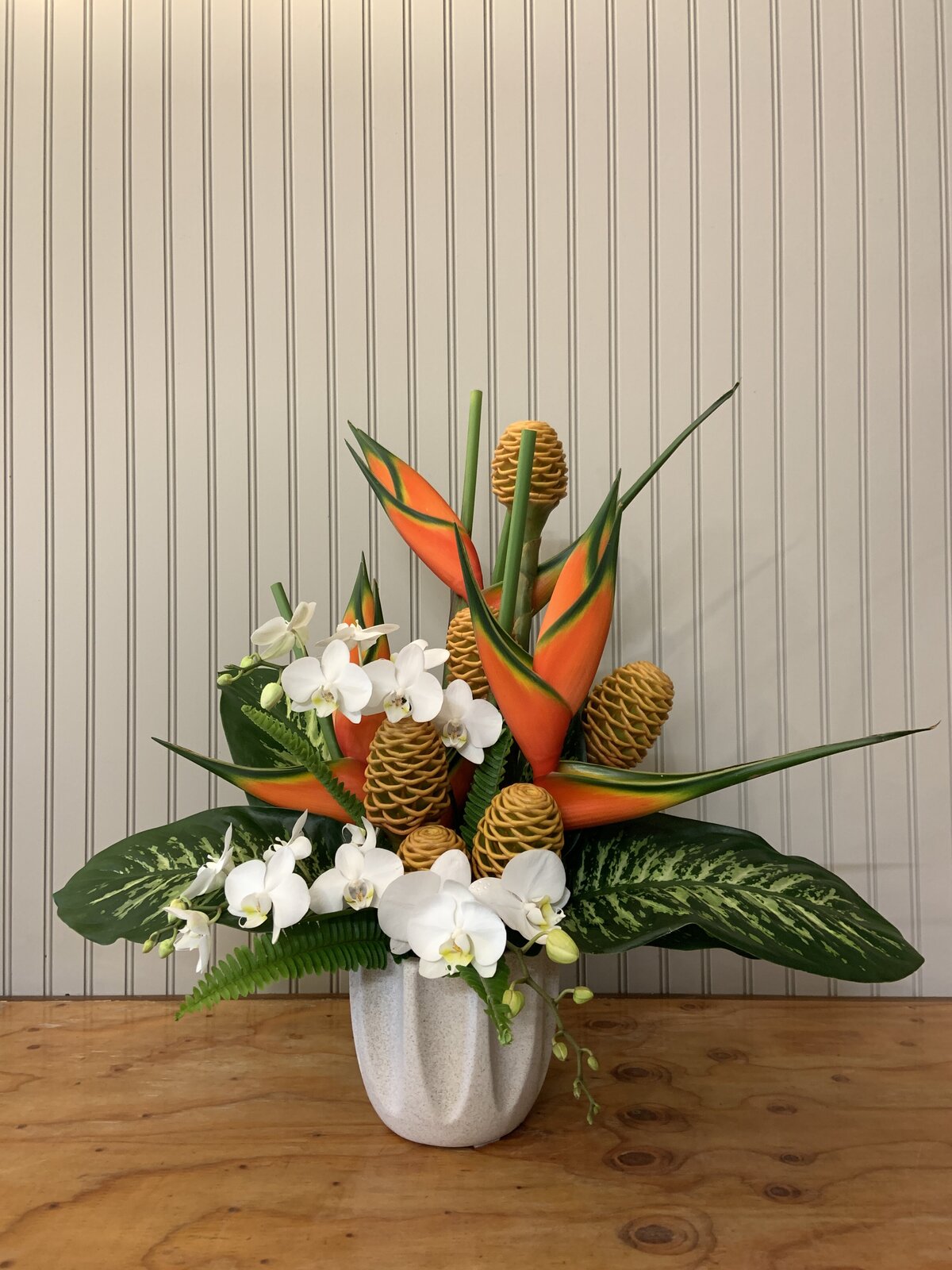White orchid and tropical flower arrangement