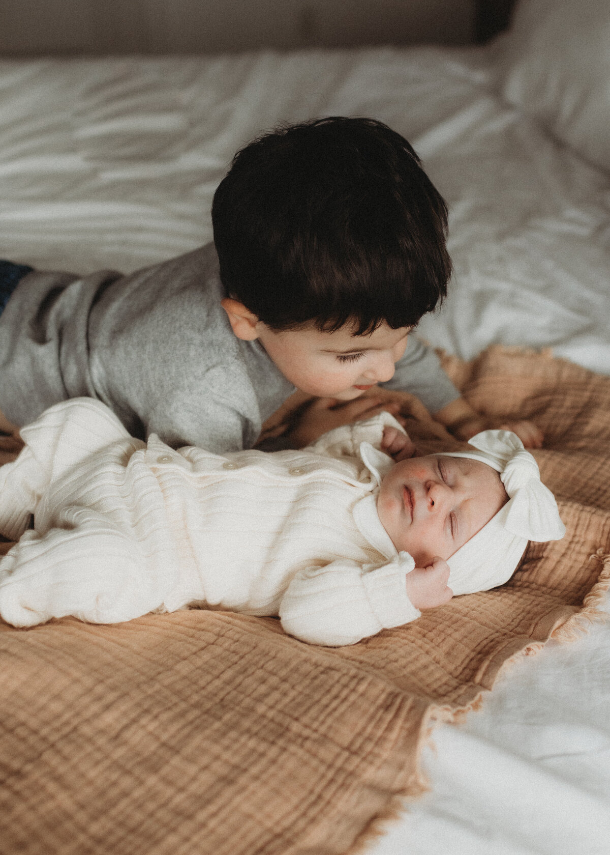 big brother and newborn sister