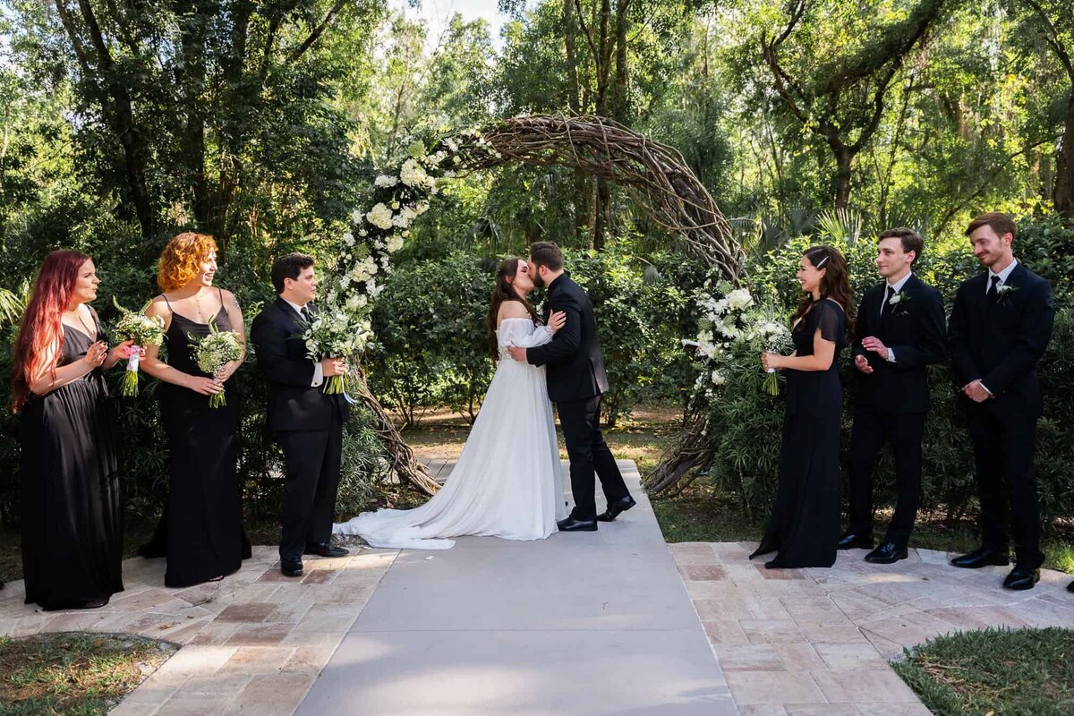 Bride & Groom's First Kiss at Tampa's premier wedding venue Bakers Ranch photographed by Lakeland Wedding photographers