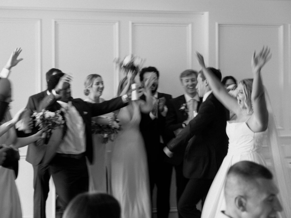 Couple with bridal party at their Cleveland Yachting Club wedding reception