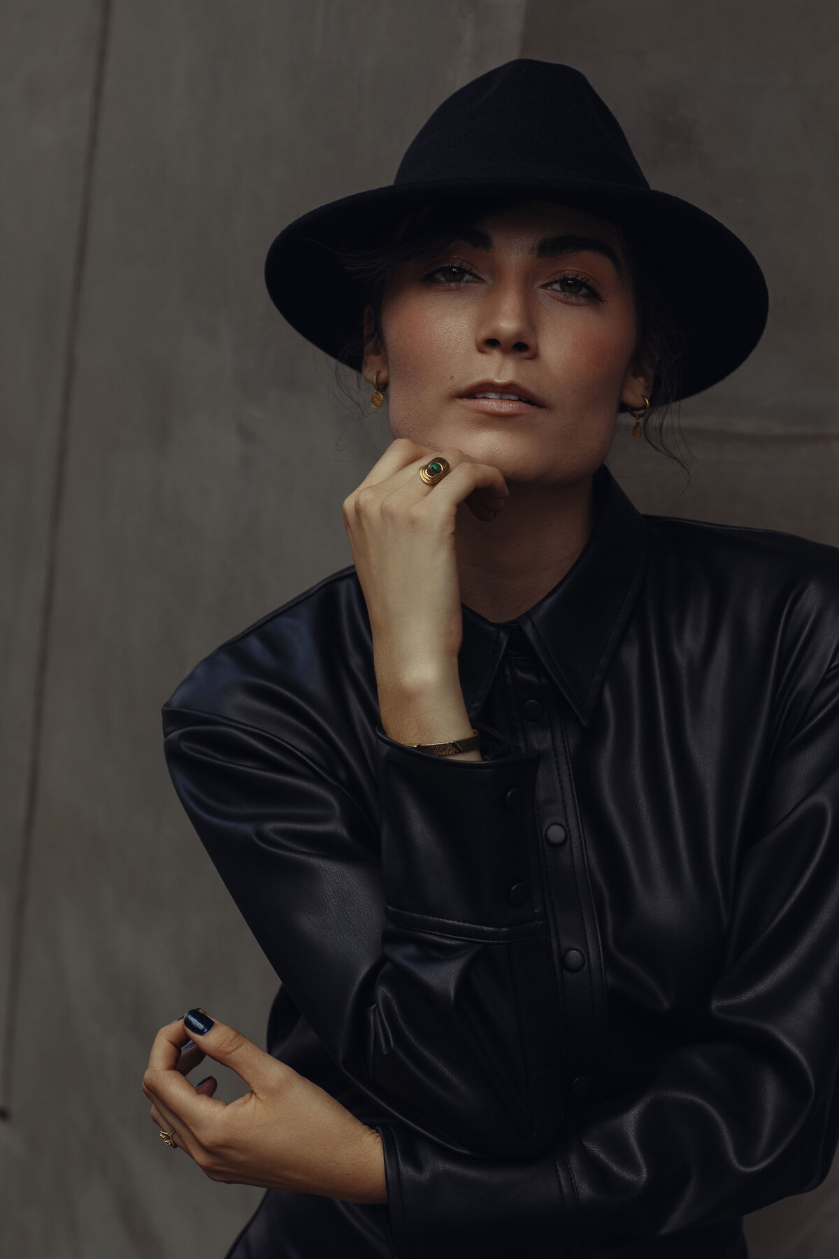 Portrait Photo Of Young Woman In Black Coat With Her Chin Up Los Angeles