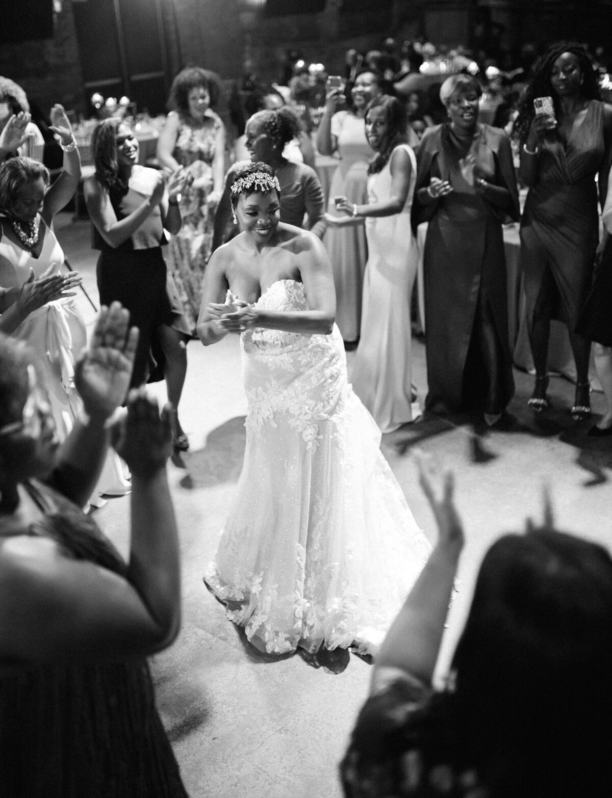documentary wedding photographer Christina Harrison captures candid dance floor wedding reception photo of bride at Garden Theater, Detroit