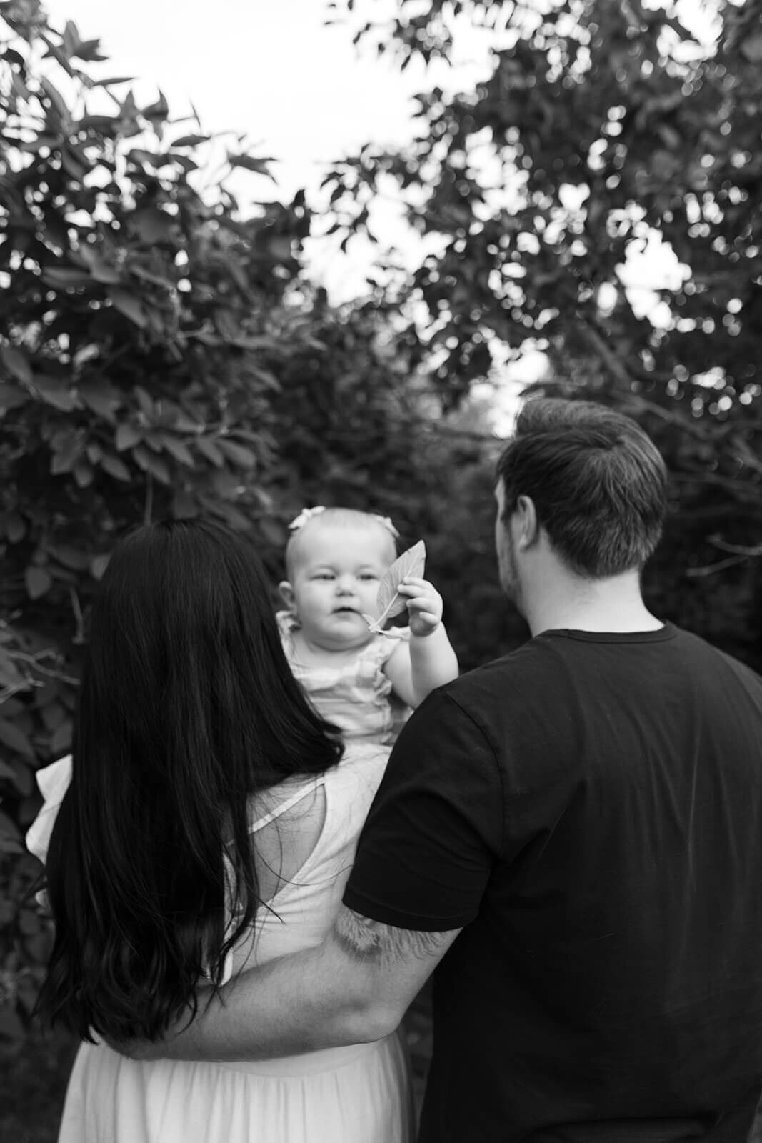 Baby-holding-leaf