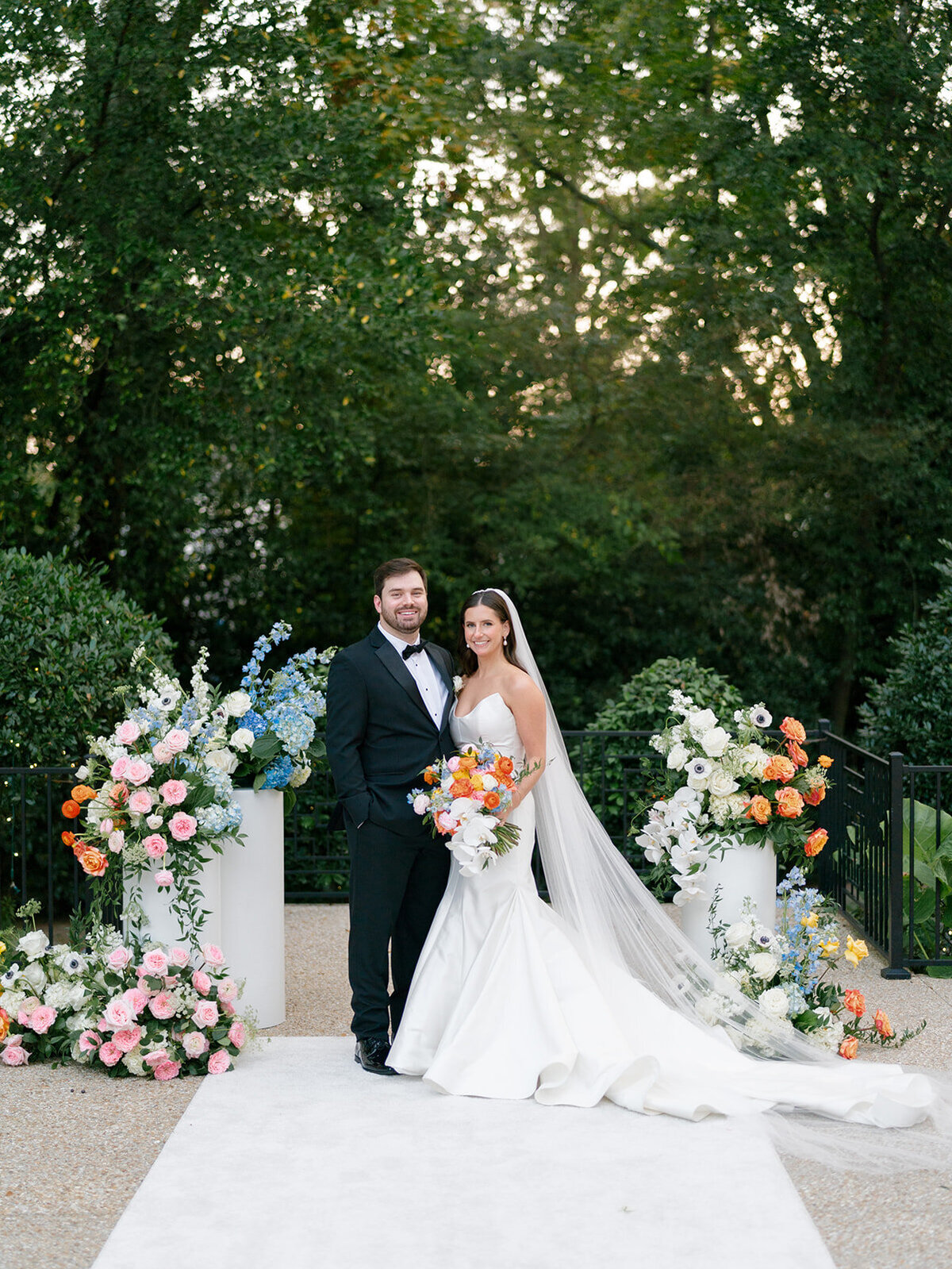 bride and groom portrait at altar with flowers