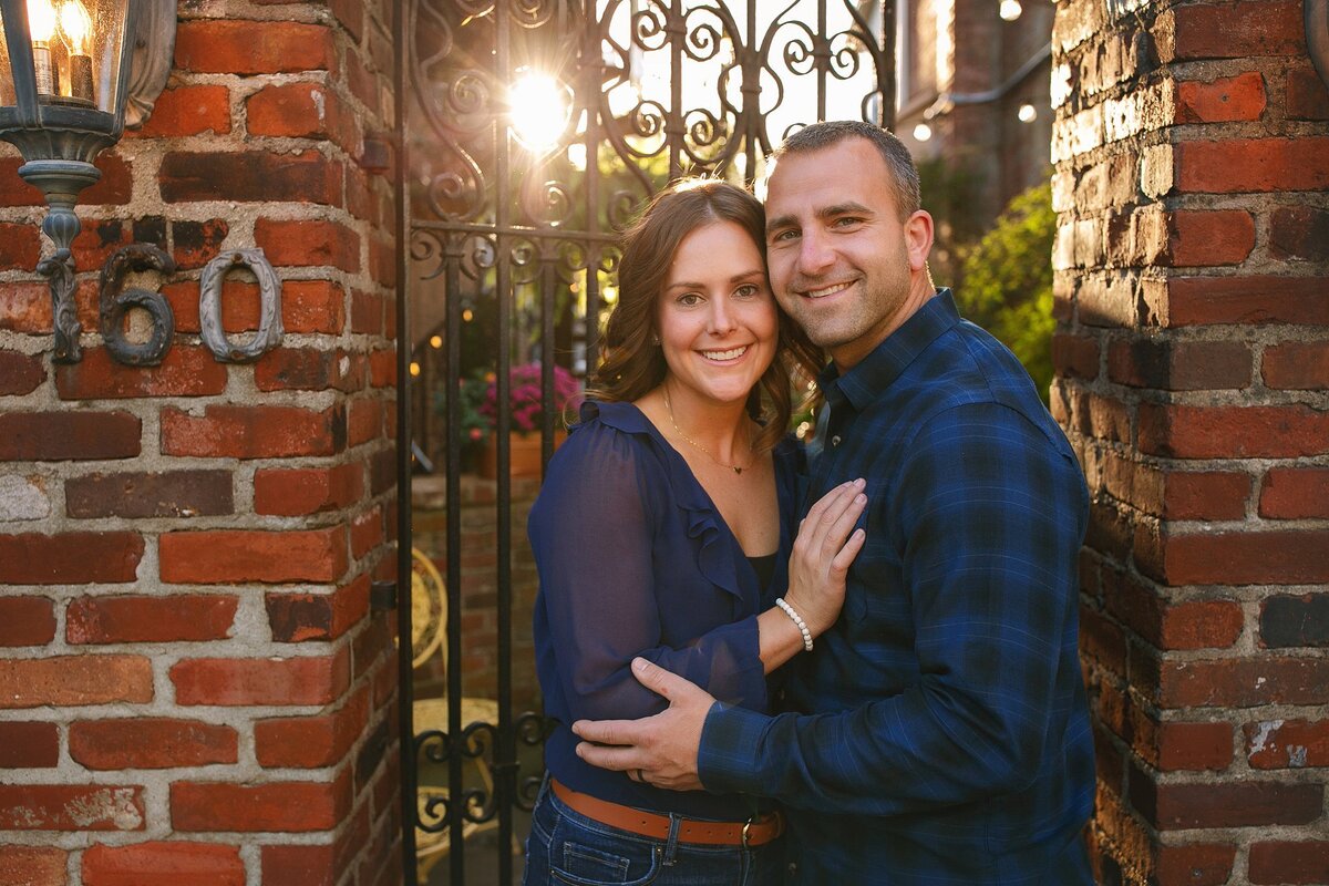 A-couple-embracing-in-a-modern-kitchen-in-Zionsville-Indiana-during-an-intimate-lifestyle-photo-session-capturing-the-cozy-small-town-vibe