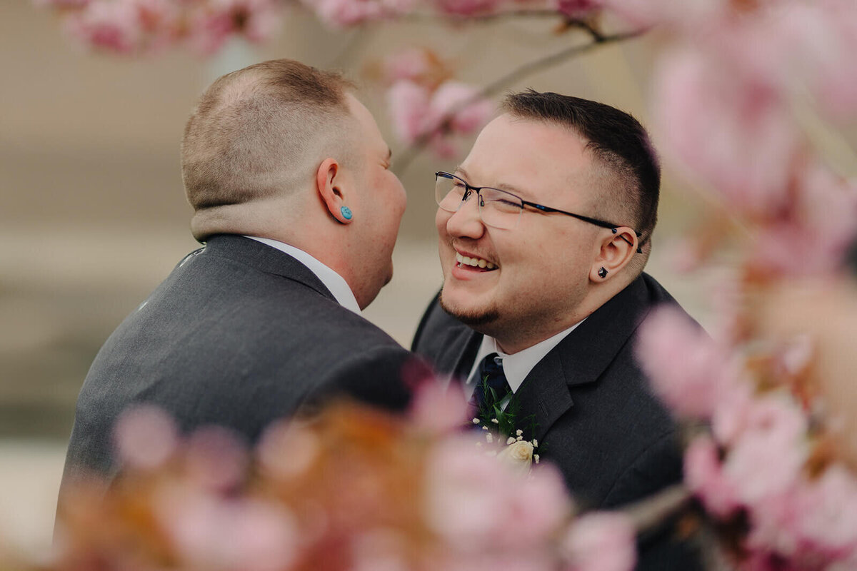 Gay couple amongst the cherry blossom in Rochester NY