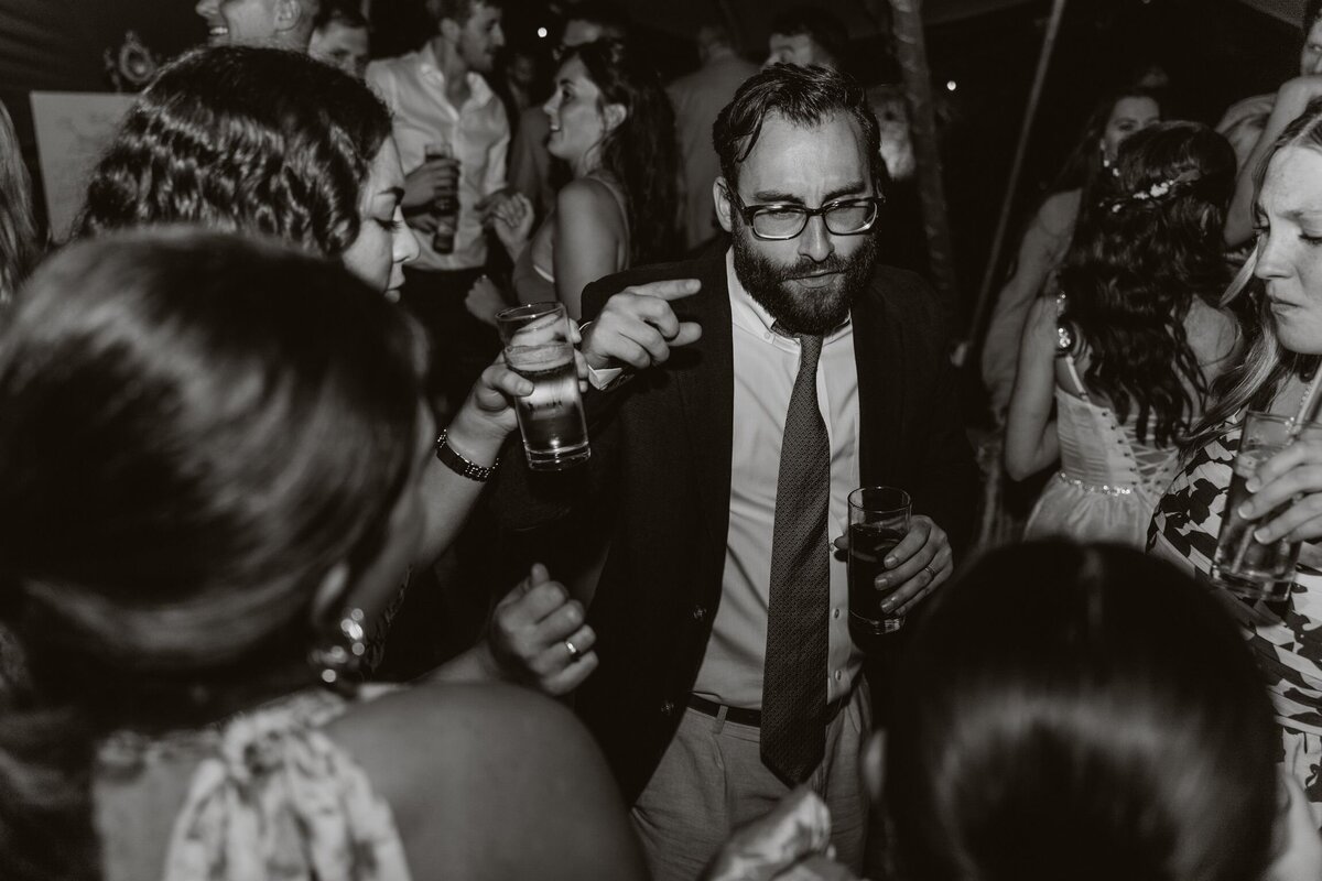 Mum and dad dancing on the dancefloor at their daughters wedding in Tenby