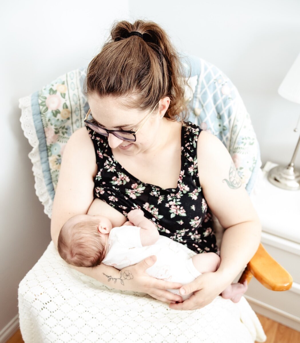 A new mom breastfeeds her two day old baby in her Edmonton home