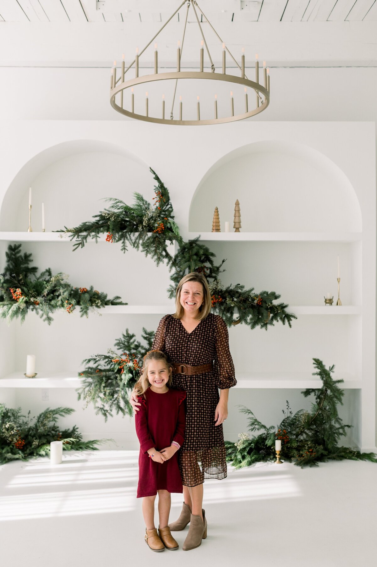 Mom and daughter in maroon dresses