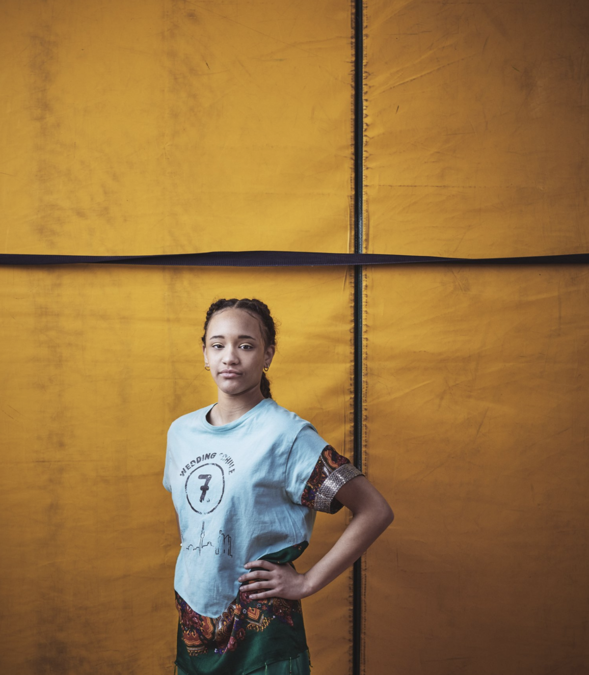 A character outdoors, bathed in natural golden hour tones.